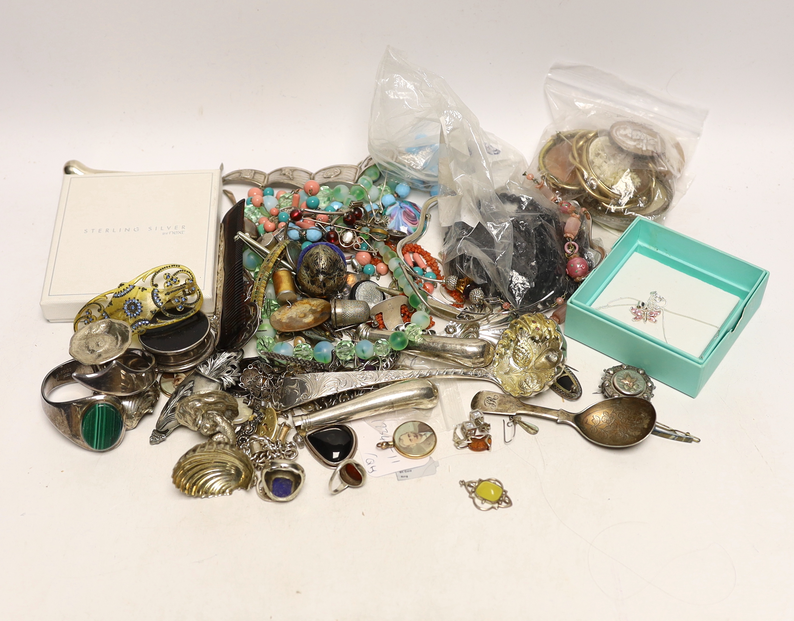 A quantity of assorted costume and other jewellery including a Charles Horner white metal and gem set brooch and sundry silver including two 19th century caddy spoons and a Georgian sifter spoon.